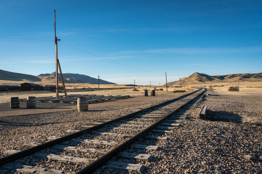 Photo of train tracks in the desert