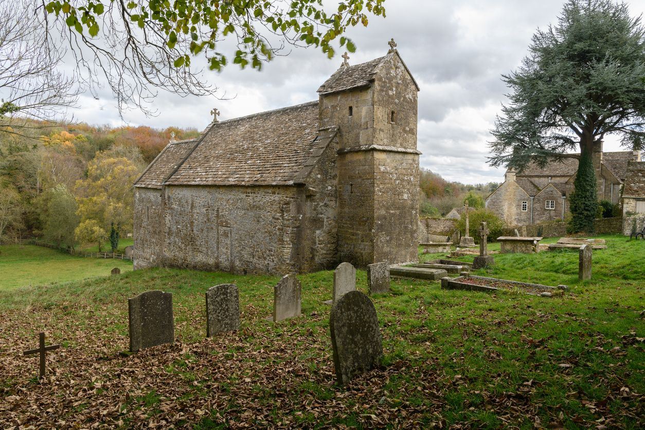 Photo of an old church and graveyard