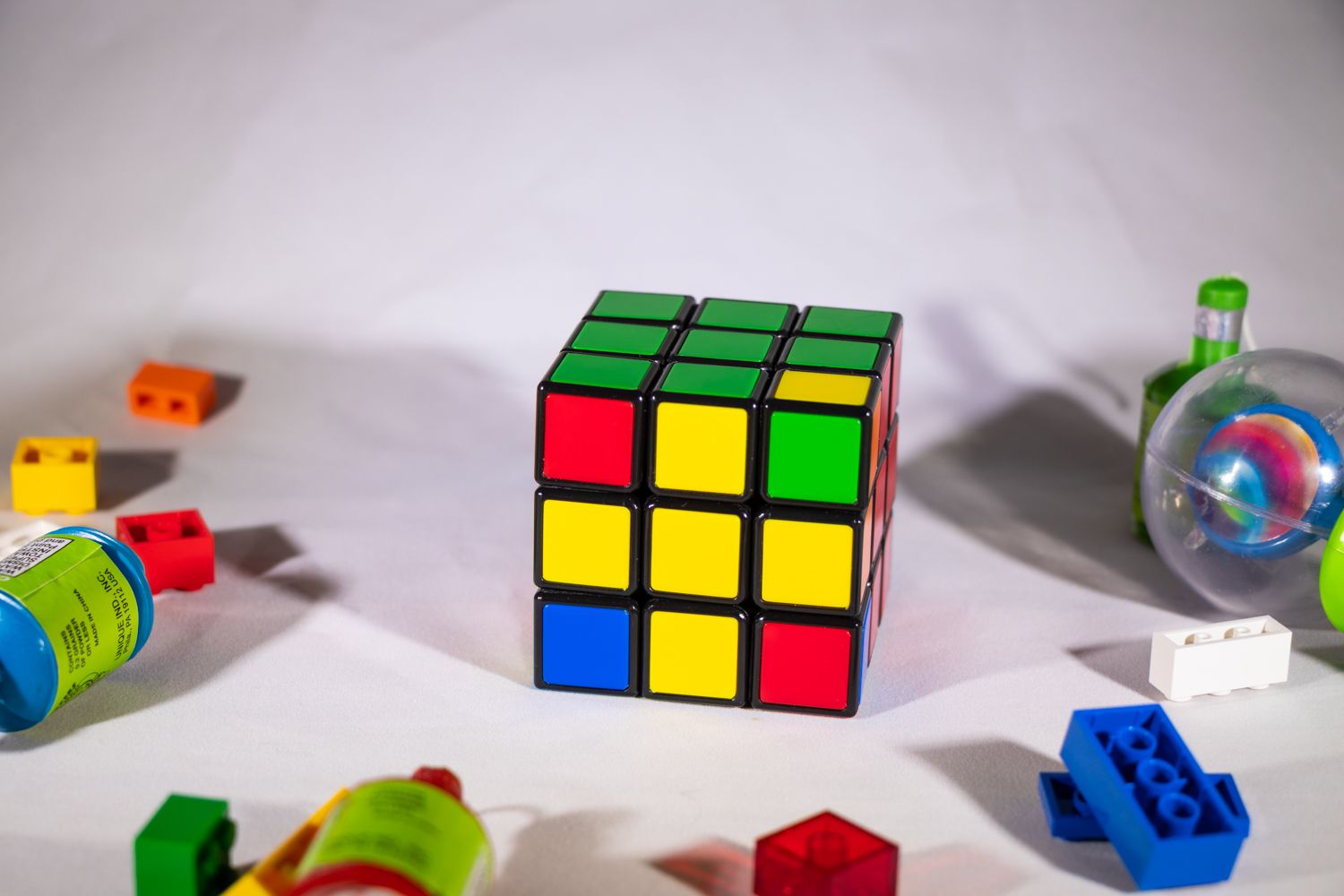 Up close view of Rubik's Cube showing yellow cross on front surface
