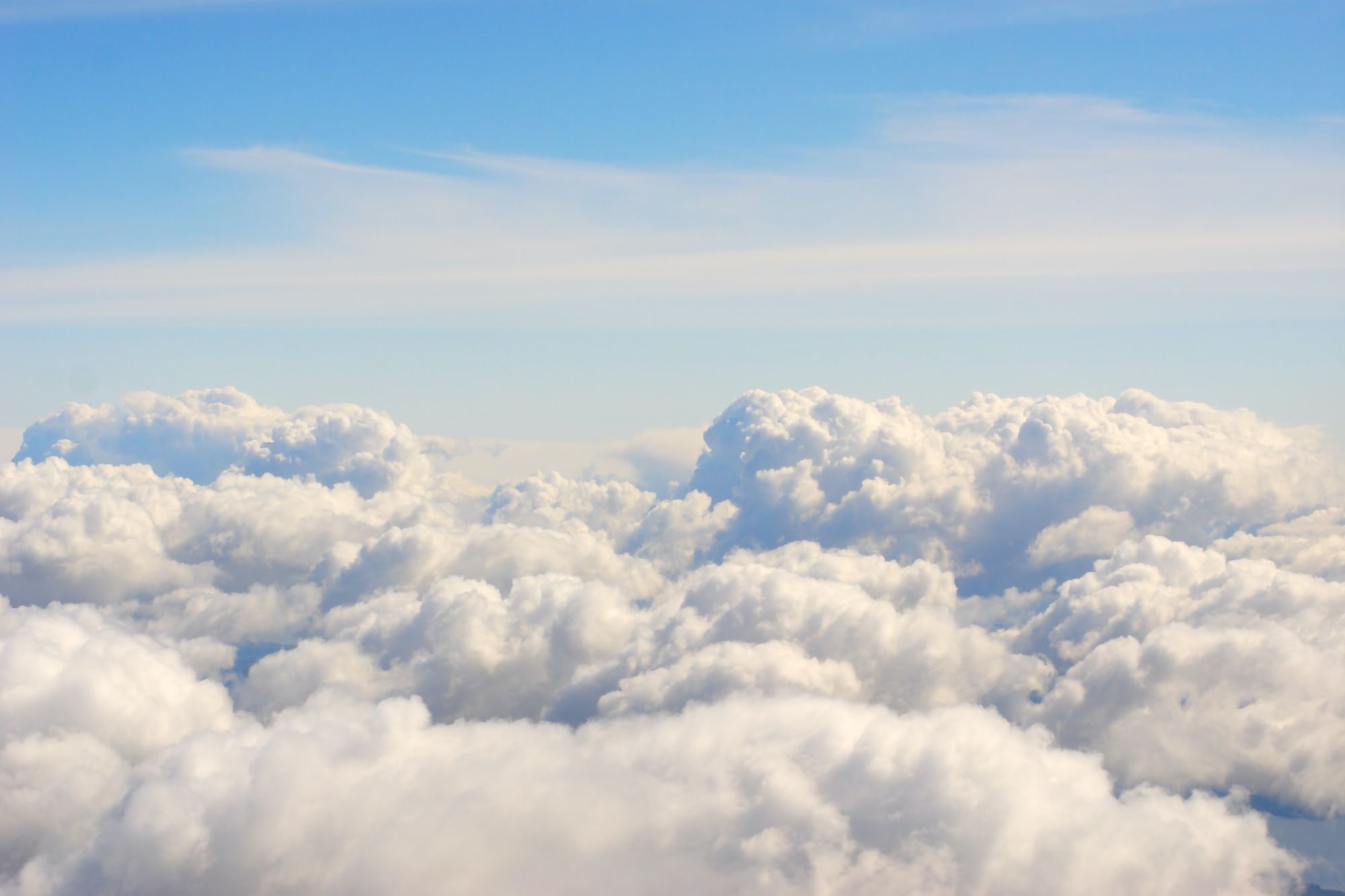 Group of fluffy clouds with blue sky