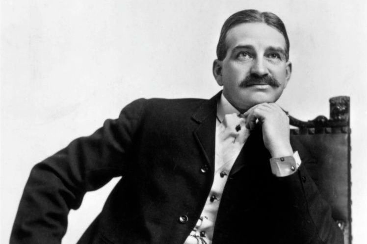 L. Frank Baum sitting in a chair