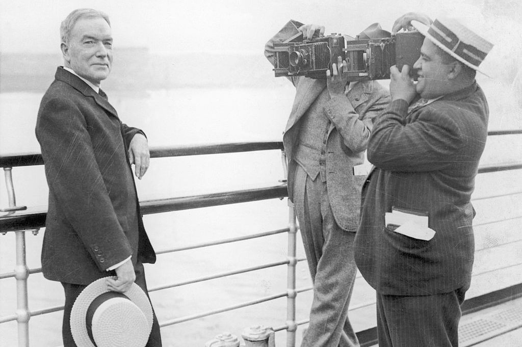 John D. Rockefeller being photographed