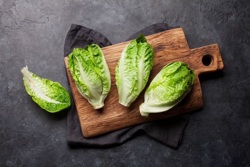 Romaine lettuce on a wooden cutting board