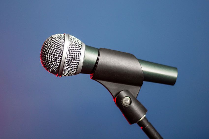 Close up of an unwired microphone on a stand.