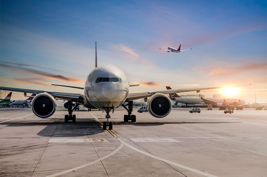 Front view of an airplane on a runway.