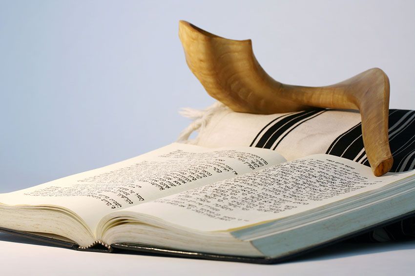 A copy of the Torah sits on a table.