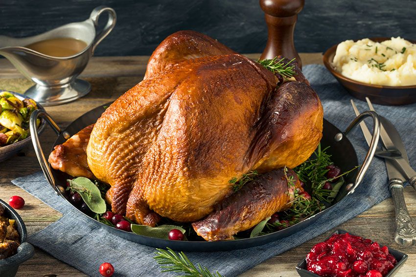 Homemade smoked turkey dinner for Thanksgiving with sides.