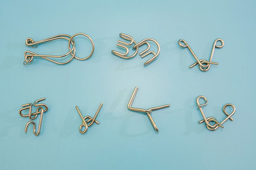 Metal puzzles on a blue background.